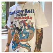 Vintage 1987 Dragon Ball Z Calendar T-Shirt Black Anime Graphic Tee Retro Manga-Inspired Apparel Stylish Casual Outfit Collectible Fan Merchandise Classic DBZ Design Nostalgic Streetwear